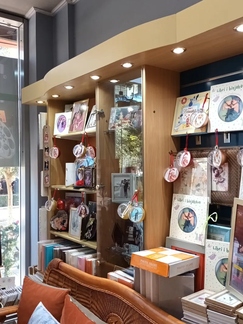 Inside the studio: lit shelves with frames and photo gifts