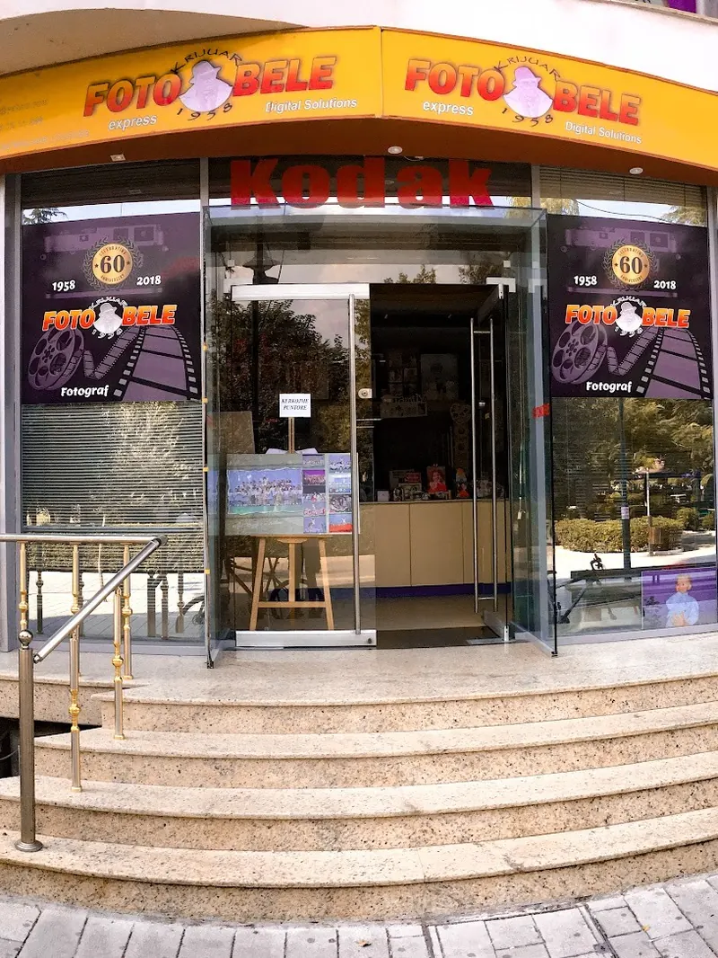 The Foto bele storefront on Rruga Muharrem Agolli by day