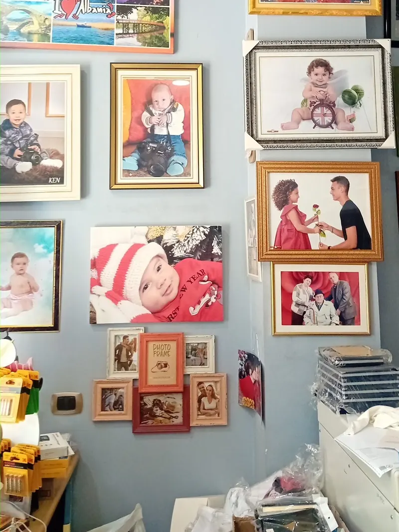 Children’s portraits and canvas prints on the studio wall